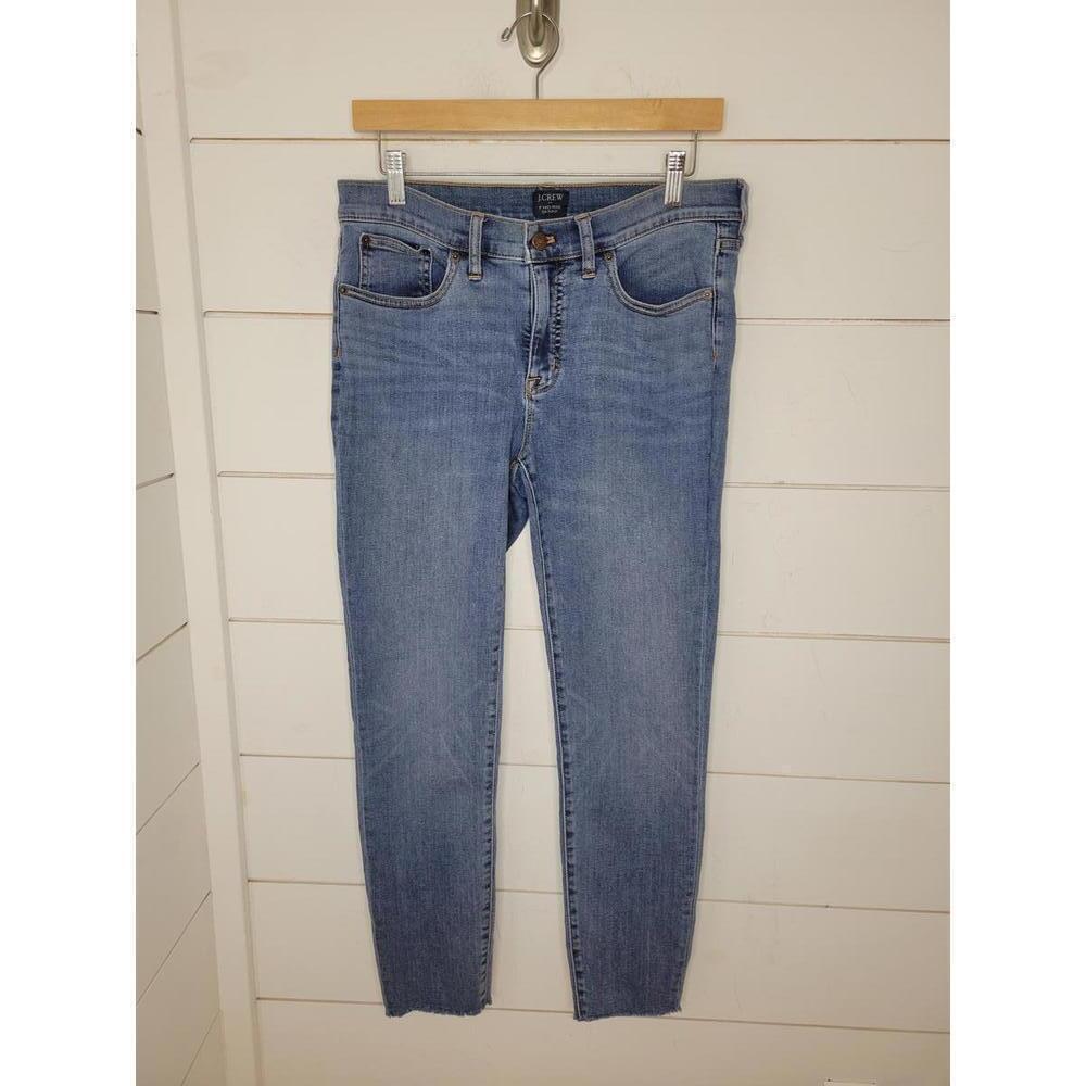 J Crew size 29 blue denim 8" mid-rise skinny jeans. Short raw edge